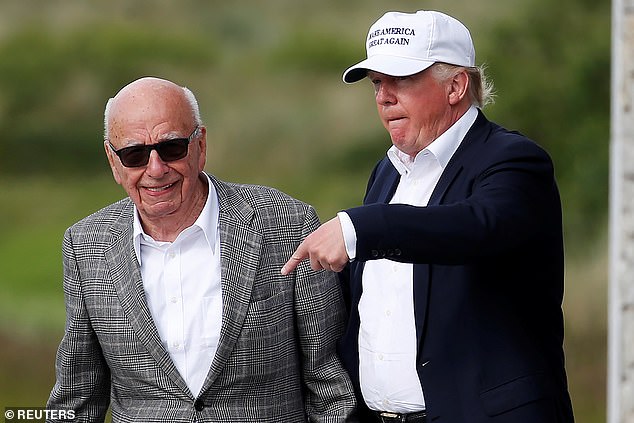 Murdoch and Trump are pictured together at his Scottish golf course in June 2016
