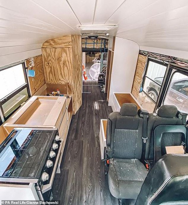 The couple bought the old school bus (pictured during its conversion) for just $4,800 after finding that a new van would be anywhere from $55,000 to $70,000