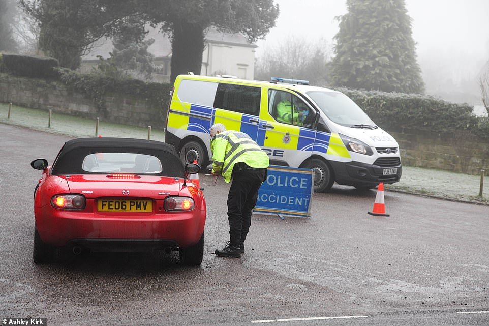Derbyshire police were pictured turning drive
rs away at a vehicle checkpoint at Calke Abbey, near Ticknall, yesterday afternoon