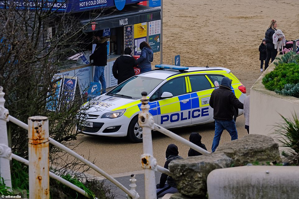 Police and Covid marshals patrol the seafront in Bournemouth this morning to spot any people breaking the rules