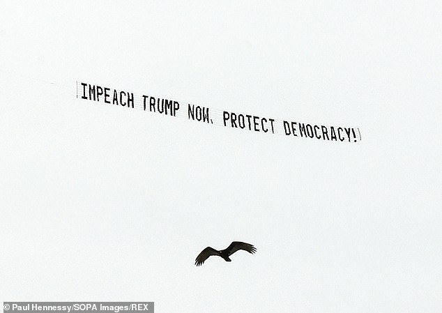 ORLANDO: A plane towed a banner calling for Trump to be impeached to 'protect democracy' in his remaining days in office