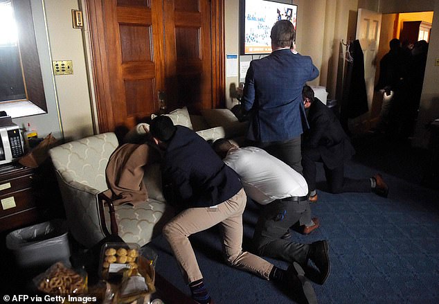 Congressional staffers barricade themselves inside their offices as Trump supporters rampage through the C
apitol Building