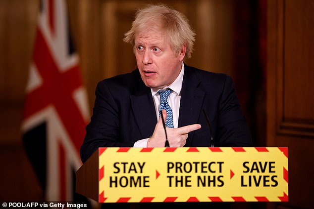 Boris Johnson attends a virtual press conference on the COVID-19 pandemic, inside 10 Downing Street in central London on January 7