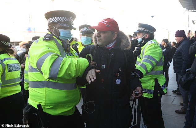 After reaching the Argos store in Clapham, a video which was broadcast online showed brief scuffles between protesters and police as officers appeared to arrest one man. At least 10 officers could be seen surrounding the protesters