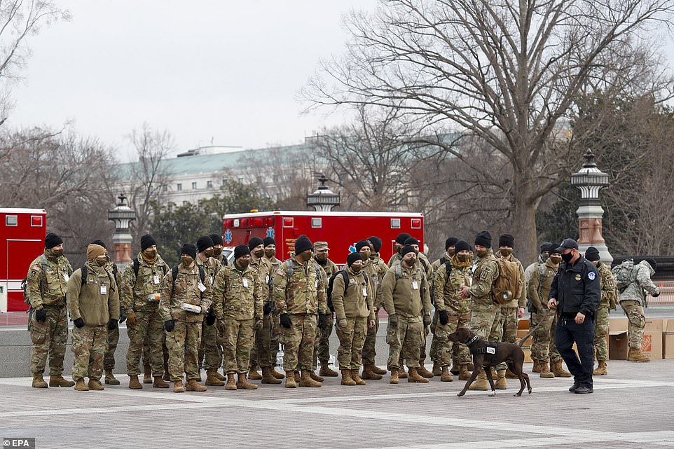 Members of the New York National Guard organize on the East Front of the US Capitol on Monday morning