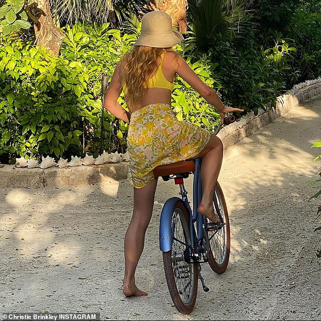 A happy ride in paradise: The Christie look-alike was seen taking a bicycle ride
