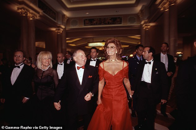 Adelson pictured center with Sophia Loren at the opening of the Venetian in May 1999