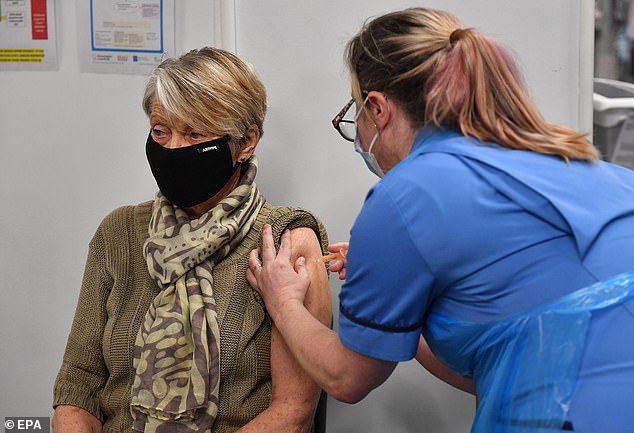 Rita Passey receives a Covid-19 vaccine at the NHS vaccine centre at Millennium Point centre in Birmingham on Tuesday
