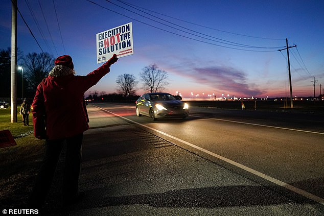 Protesters in opposition to the death penalty gathered to protest the execution of Lisa Montgomery outside the United States Penitentiary in Terre Haute, Indiana on Tuesday