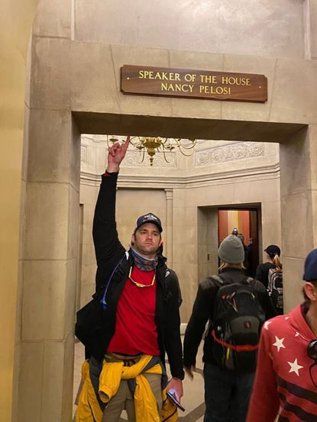 Williams was arrested after he was identified in a photo that was sent anonymously to the WKMG news station. Williams is seen wearing a 'Trump 2020' hate while pointing to a placard with Speaker of the House Nancy Pelosi written on it