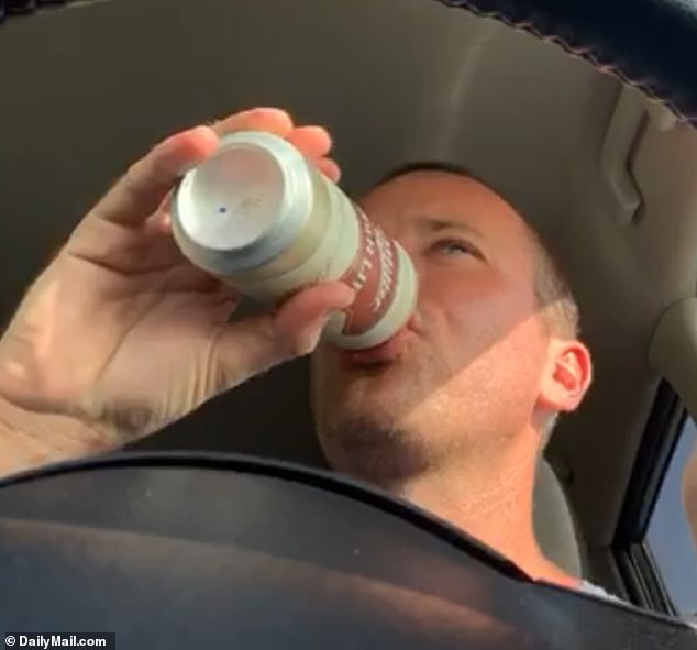 In another video, Hammer sports the same hairstyle and appears to be driving alone. The camera seems to be balanced on the dashboard and appears to show Hammer taking both hands off the wheel as he raises up a Miller Lite and cracks it open
