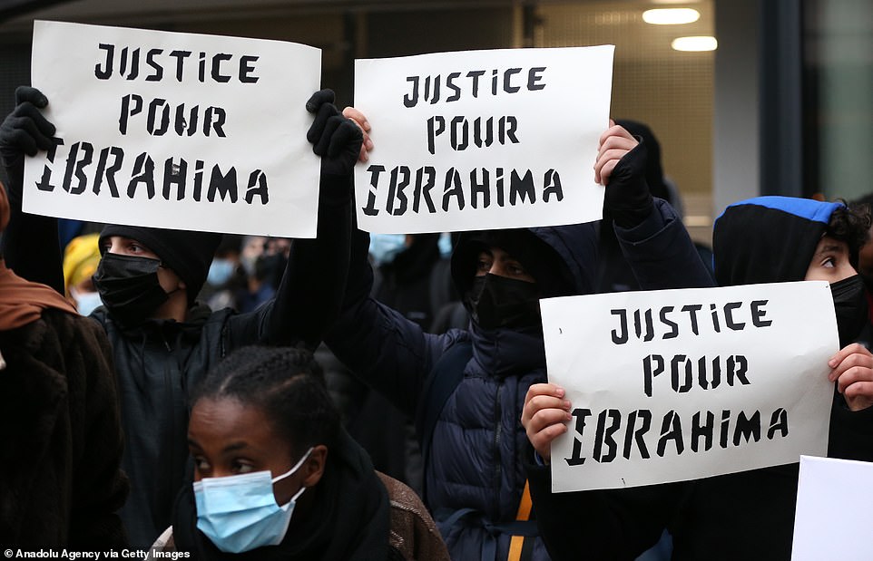 Protesters demanded authorities shed light on the circumstances surrounding the man's death on Saturday night. Pictured: Hundreds of demonstrators gather around 'Gare du Nord' during a demonstration, some holding signs that said 'justice for Ibrahima' (pictured)
