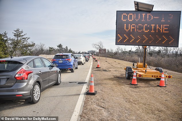 Cars in New York on Wednesday as people arrive for their COVID-19 vaccines by appointment