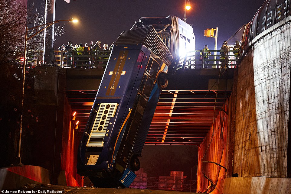 An MTA bus dangles over a Bronx overpass in a crash that left at least eight people injured