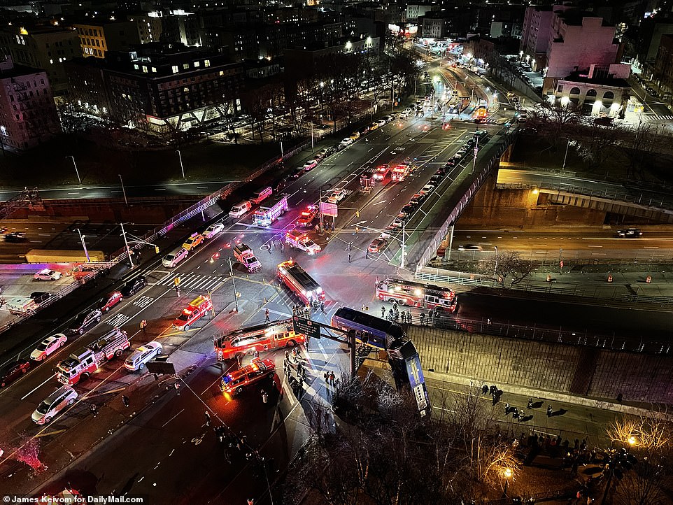 An aerial view of the dangling bus above late Thursday evening