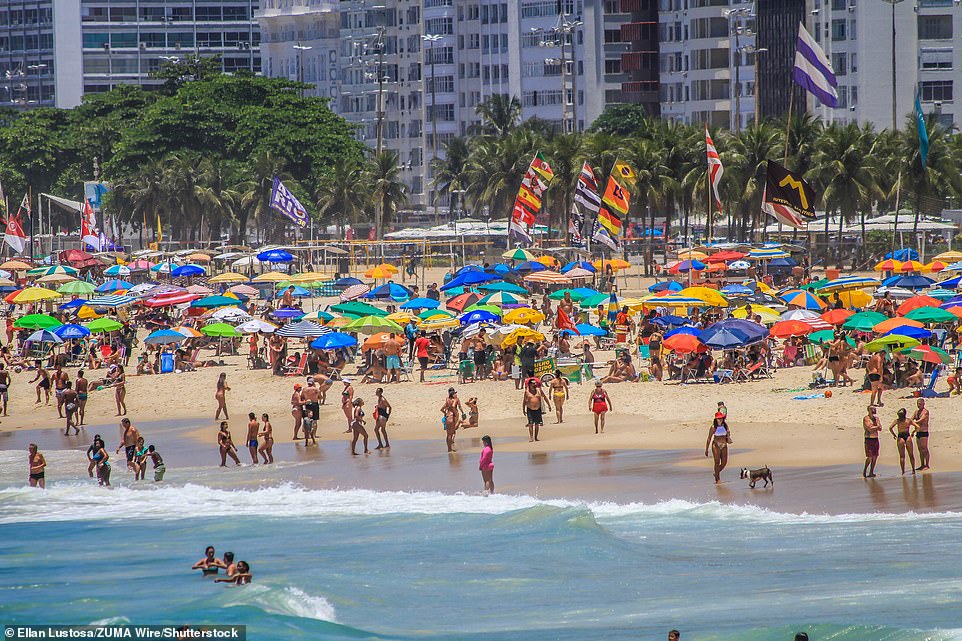 From the tightly-bunched shade umbrellas that covered the golden sands of Lemme beach in Rio de Janeiro, one would not know the country is in the teeth of a devastating pandemic driven by the new strain