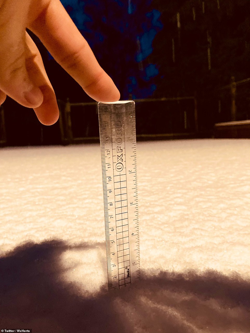 A Twitter-user in Enfield, London, took out a ruler to measure almost a centimetre of snow this morning. He wrote: 'It’s tried its best to settle on gritted roads but intensity is lowering now to 4/10 EN4 #uksnow ..embarrassingly this is probably the most snow here in almost 2 years (since early Feb 2019)'
