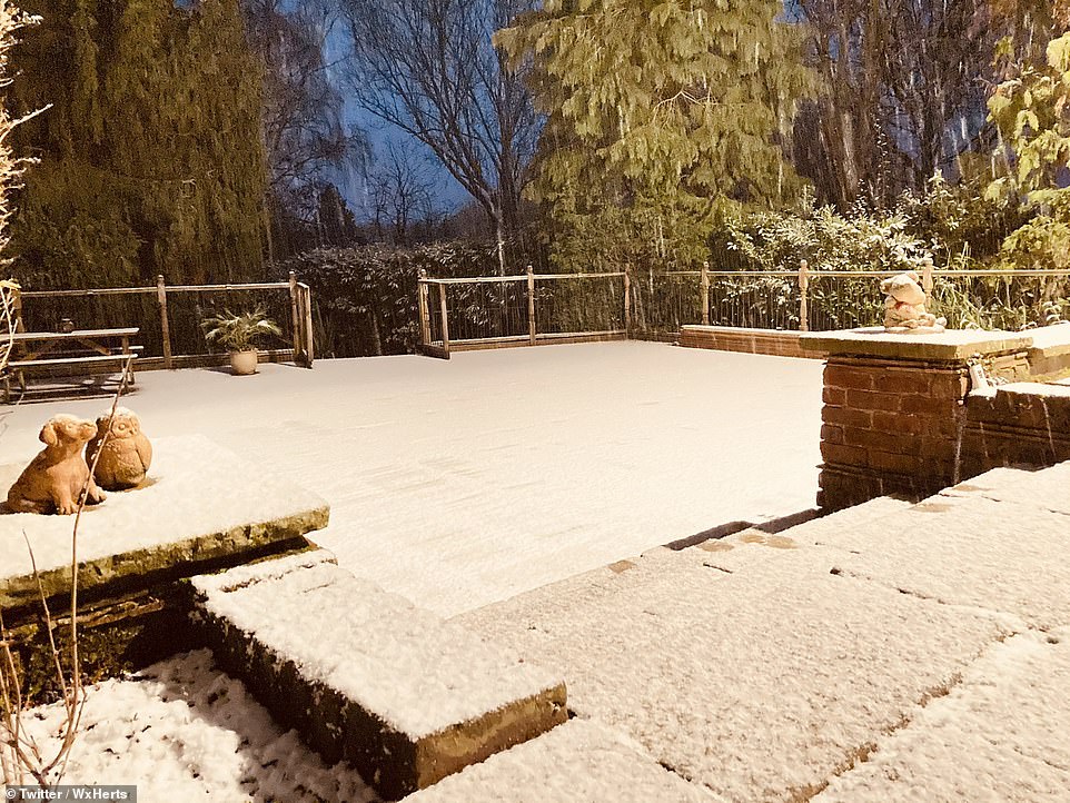 Snow in Enfield, London, as the sun started to rise early Saturday morning ahead of a day of wet and wintry weather