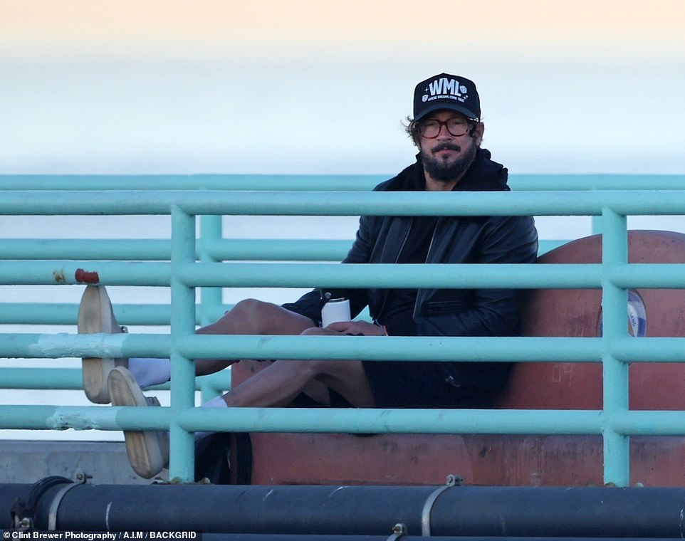 The 42-year-old looked downcast and pensive as he sat and gazed out at the ocean for about half an hour
