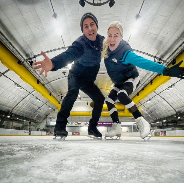 Denise and partner Matt pose for a photo together on the ice