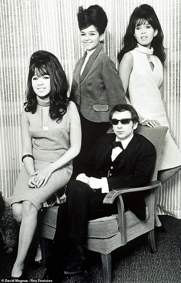 Spector pictured seated with The Ronettes in the 1960s