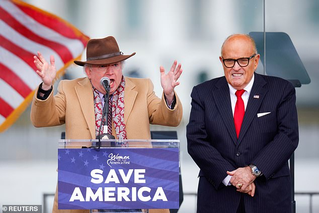John Eastman (left), who joined Trump's personal lawyer Rudy Giuliani on stage at the January 6 rally, is being considered for a role on Trump's defense team, sources said