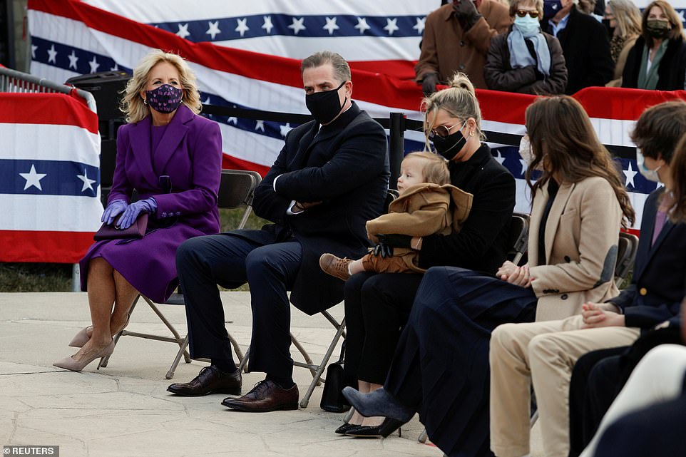 Family: Joe Biden paid tribute to his son Hunter (second left) and daughter Ashley (second right). Hunter was with his second wife Melissa Cohen, who held their 11-month-old son Beau
