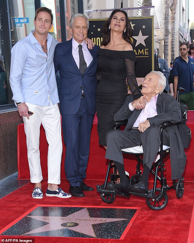 Family is everything: Cameron pictured with dad Michael, grandfather Kirk and stepmom Catherine; seen November 6, 2018 at Michael's Hollywood Walk of Fame ceremony