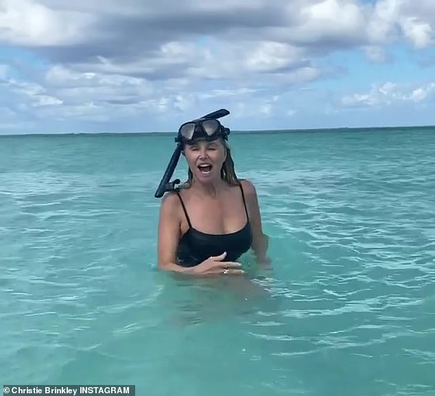 The sea life works for her: The swimsuit model was seen in this black suit last week