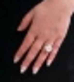 Bling: The image of the couple taken at the White House features Tiffany's large diamond engagement ring