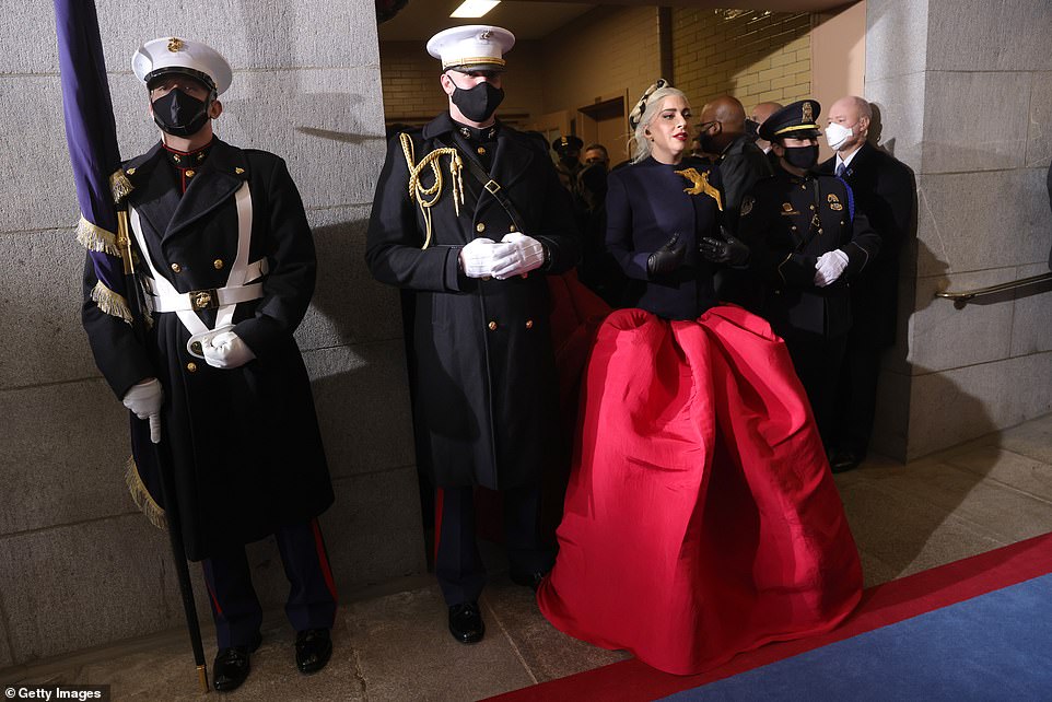 For love of country: The Million Reasons singer, 34, made a patriotic statement in a stunning blue and red Schiaparelli ballgown adorned with a gold dove