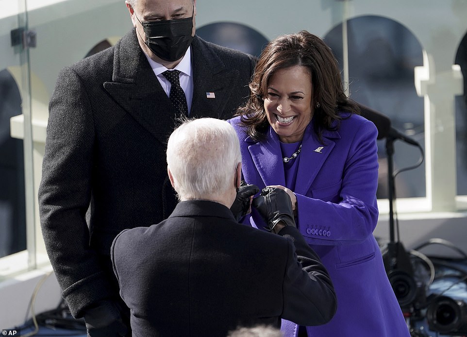Vice President Kamala Harris bumps fists with President-elect Joe Biden after she was sworn in