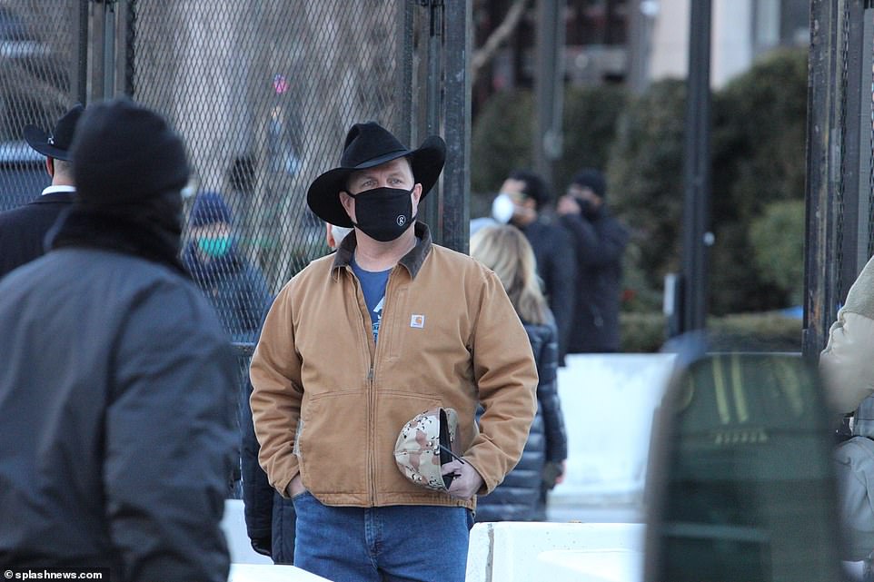 Garth Brooks leaves his hotel as he gets ready to perform at Joe Biden's inauguration Wednesday
