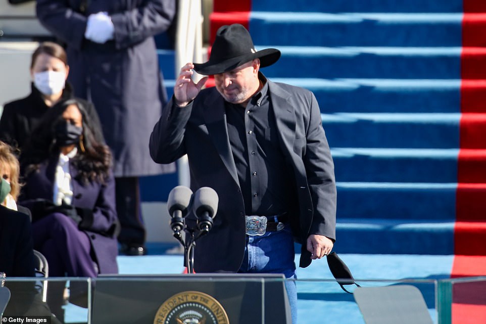 Garth Brooks emerged in his signature cowboy hat to perform at the inauguration before he took the hat off to sing