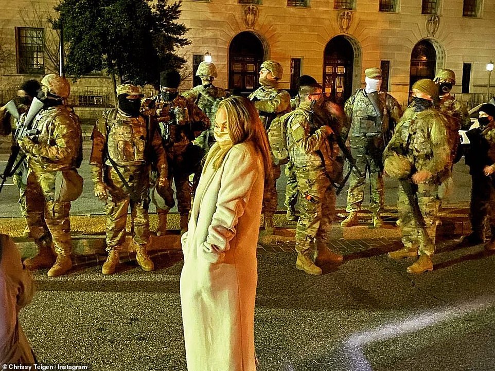 'True heroes': The star had shared several clips of John rehearsing surrounded by military members and posted pictures of herself posing with the National Guard at the Capitol