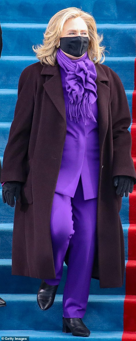 Matching: Both Michelle Obama and Hillary Clinton (pictured) wore shades of purple to the inauguration