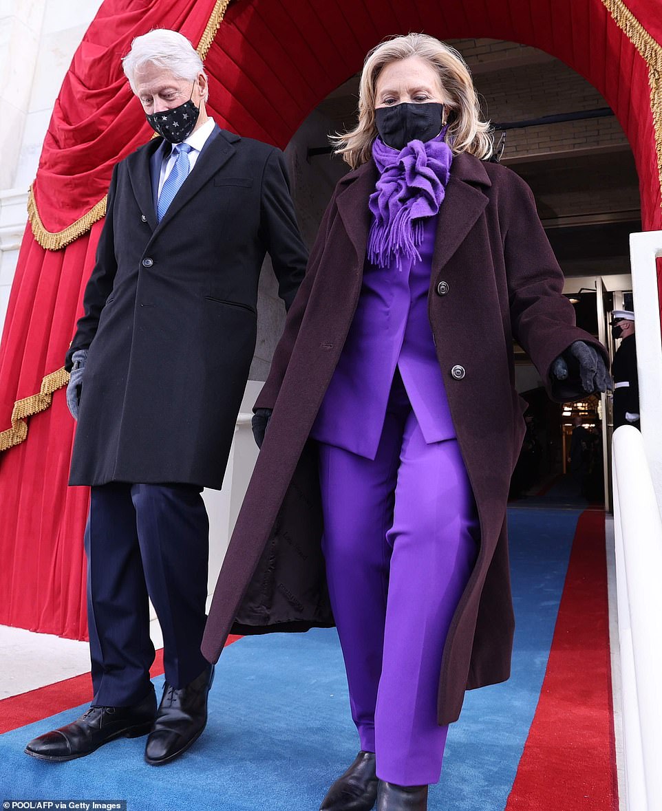 Making a statement: Hillary Clinton, 73, donned a bright purple suit and matching scarf, which she paired with a dark wool coat to keep warm