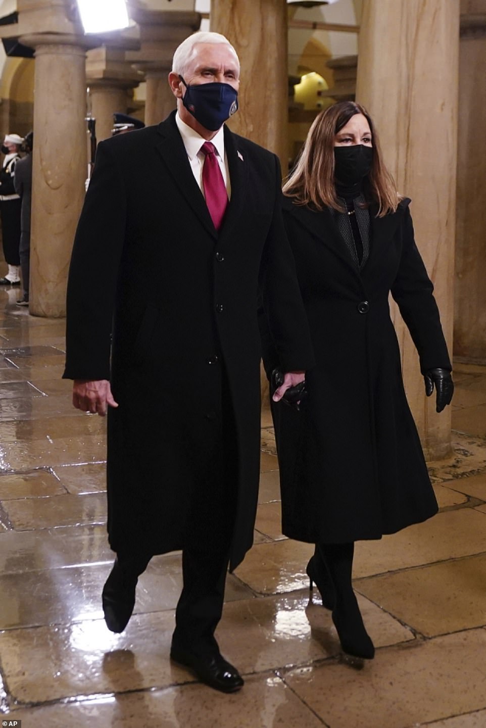 Someber: Outgoing Second Lady Karen Pence, 64, sported a black wool coat over a dark skirt suit, which she paired with black heels, black leather gloves, and a black face mask
