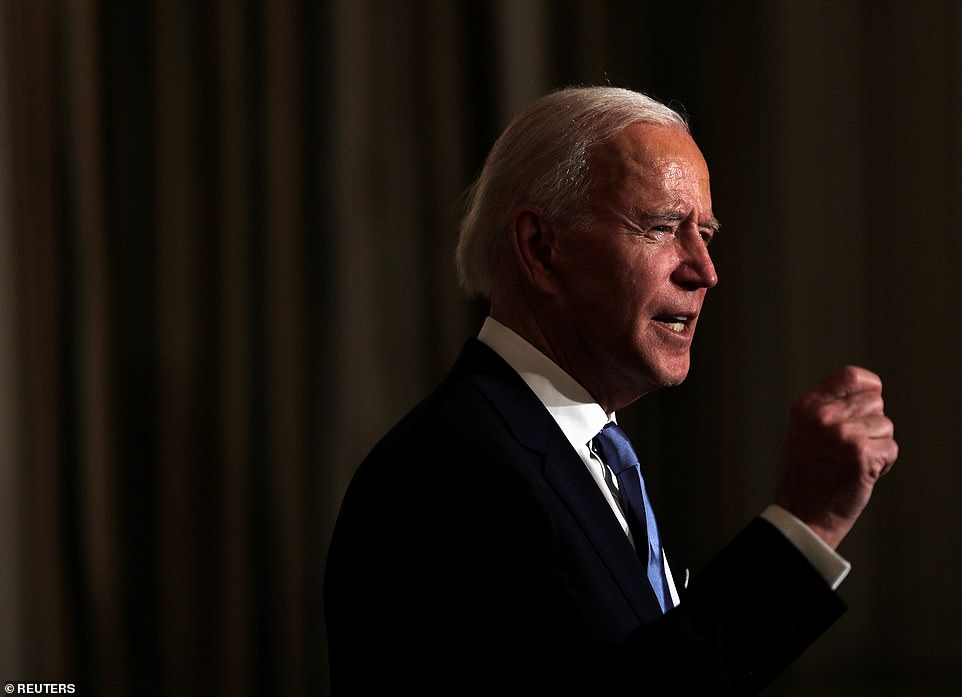 Biden swore in nearly 1,000 federal appointees and staff in a virtual ceremony in the State Dining Room at the White House. He spoke from behind a lectern, while the appointees appeared at the event via video streams set up on a series of television screens