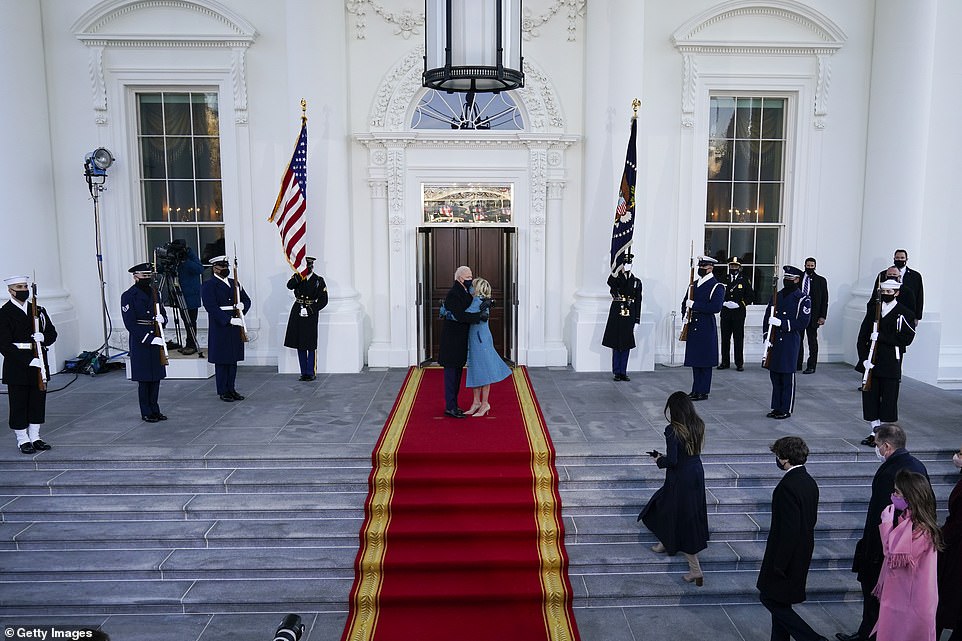 Biden got to work soon after making a grand entrance into the White House Wednesday, walking hand-in-hand with First Lady Jill Biden to their new home and saying: 'It feels like I'm going home'