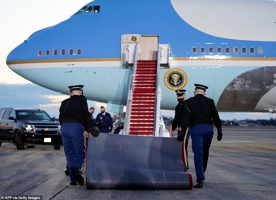 In place: The red carpet is laid down at the steps to Air Force One at Joint Base Andrews for the flight to Mar-a-Lago