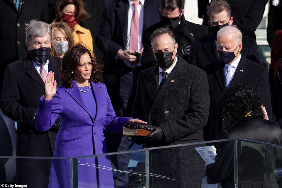 Kamala Harris is sworn in as U.S. Vice President as her husband Doug Emhoff and President Elect Joe Biden look on
