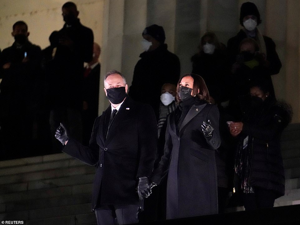 Vice-President Kamala Harris and husband Doug Emhoff dance along at the "Celebrating America" event at the Lincoln Memorial