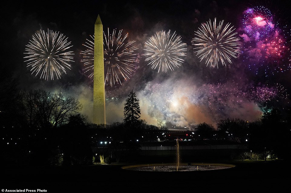 Fireworks light up the sky by the Washington Monument during inauguration ceremonies Wednesday, Jan. 20, 2021, in Washington. (AP Photo/Evan Vucci)