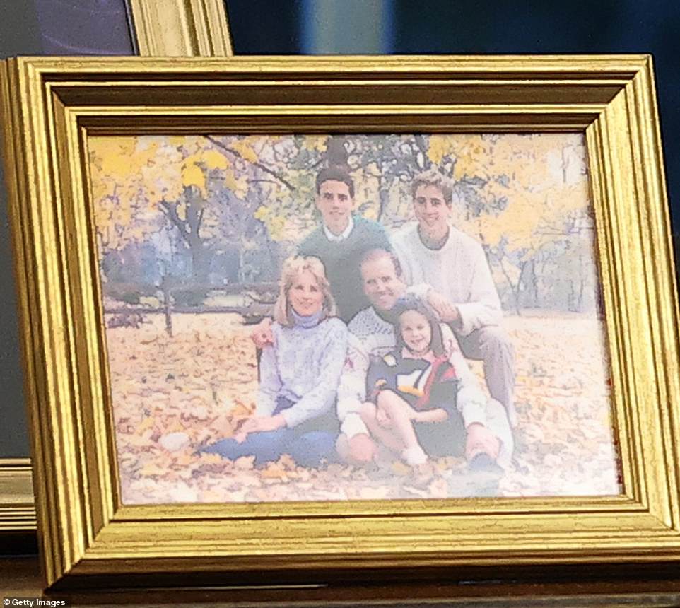 A family picture of Joe and Jill when their children - Beau, Hunter and Ashley - were young is also placed in the Oval Office