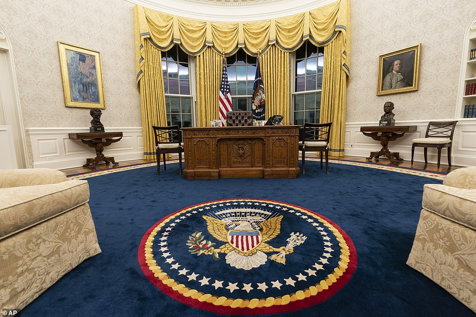 The Oval Office of the White House is newly redecorated for the first day of President Joe Biden's administration, Wednesday