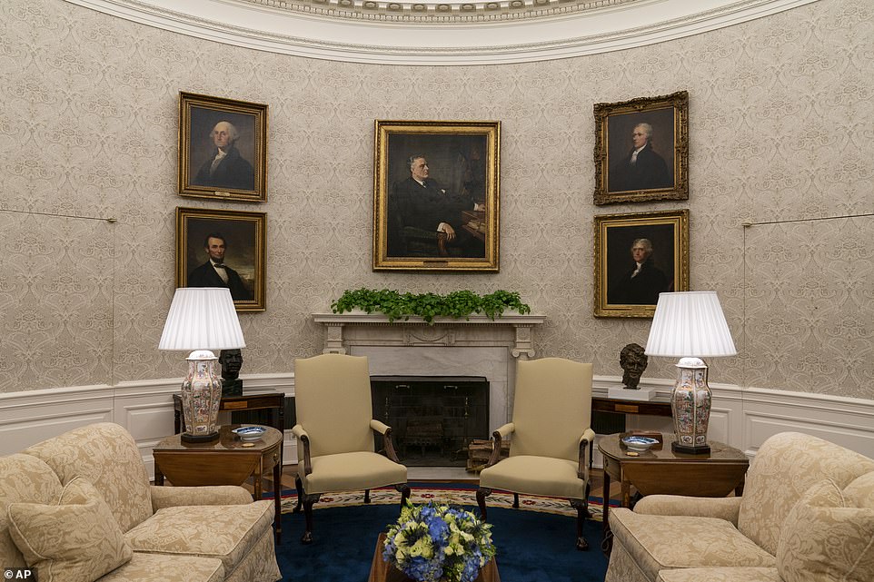 Benjamin Franklin peers down at Biden from a portrait; a painting of Franklin D. Roosevelt also hangs. Portraits of rivals Thomas Jefferson and Alexander Hamilton have been placed near one another