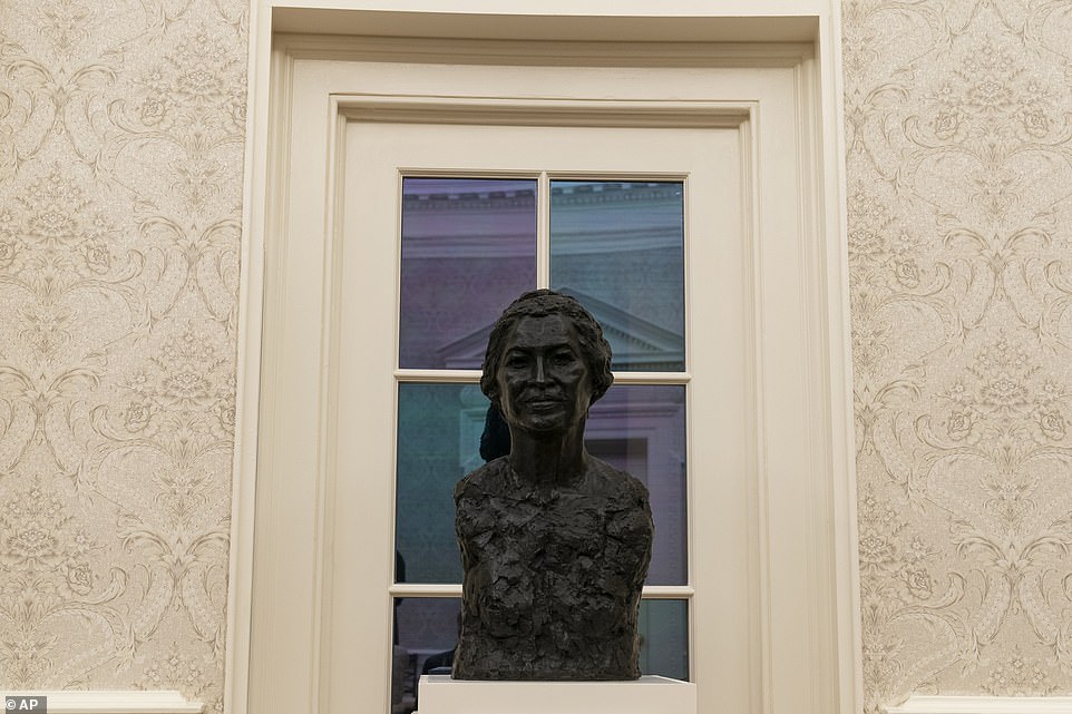 A bust of civil rights leader Rosa Parks in The Oval Office Wednesday after Joe Biden took office