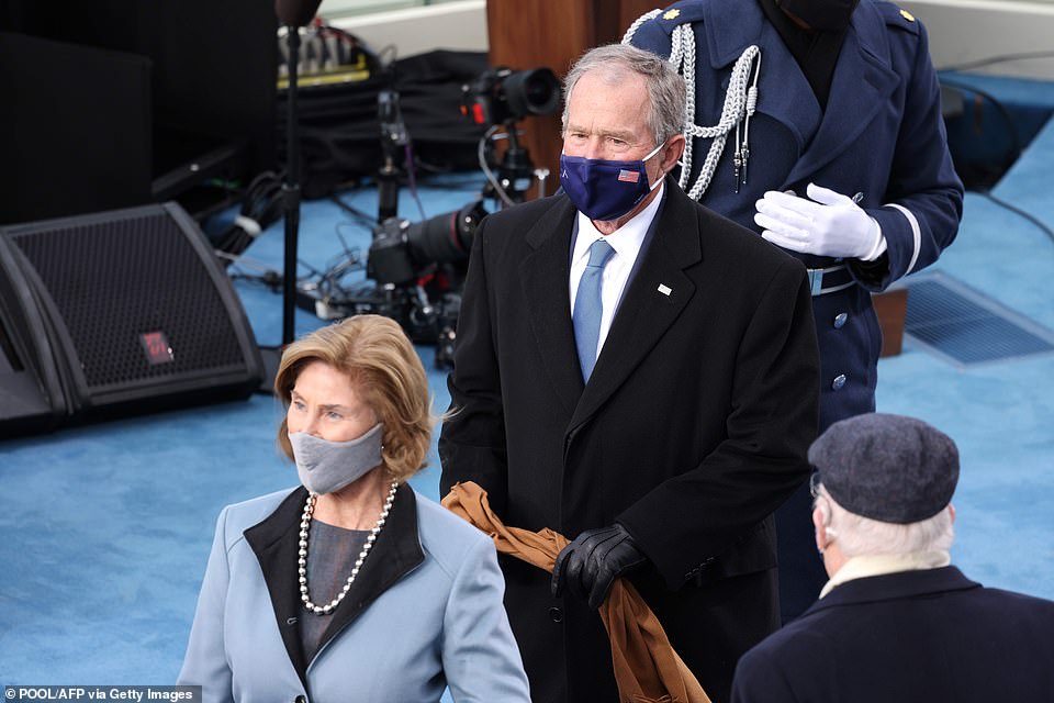 Former President George W. Bush and his wife Laura are seen before US president-elect Joe Biden is sworn in