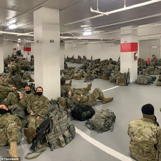 Pictures show Guardsmen sleeping on the floor of the packed parking lot Thursday. It is not known why the troops were moved from Capitol buildings